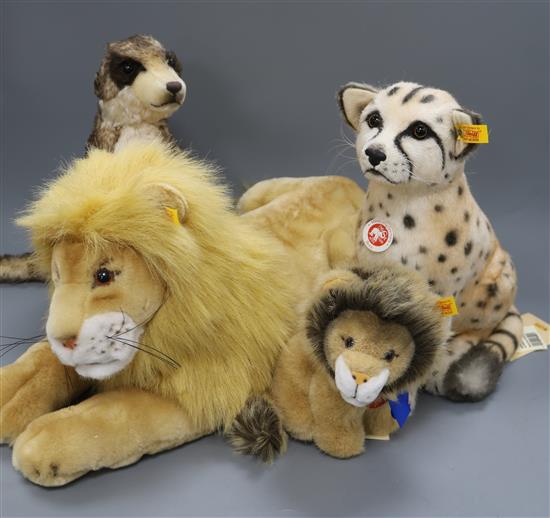 Four Steiff yellow tag toys: Molly Lion, Snuffi Lion, Bora Cheetah, and Mungo Meerkat